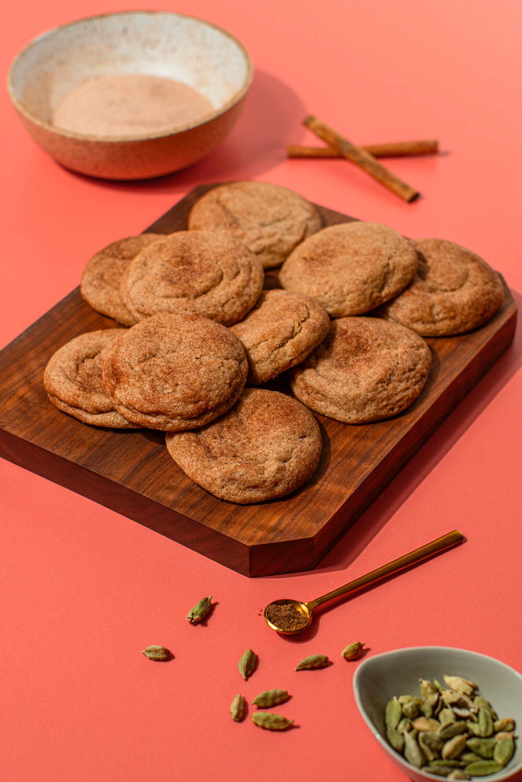 A plate of Chai Snickerdoodles sits at the center of the image.